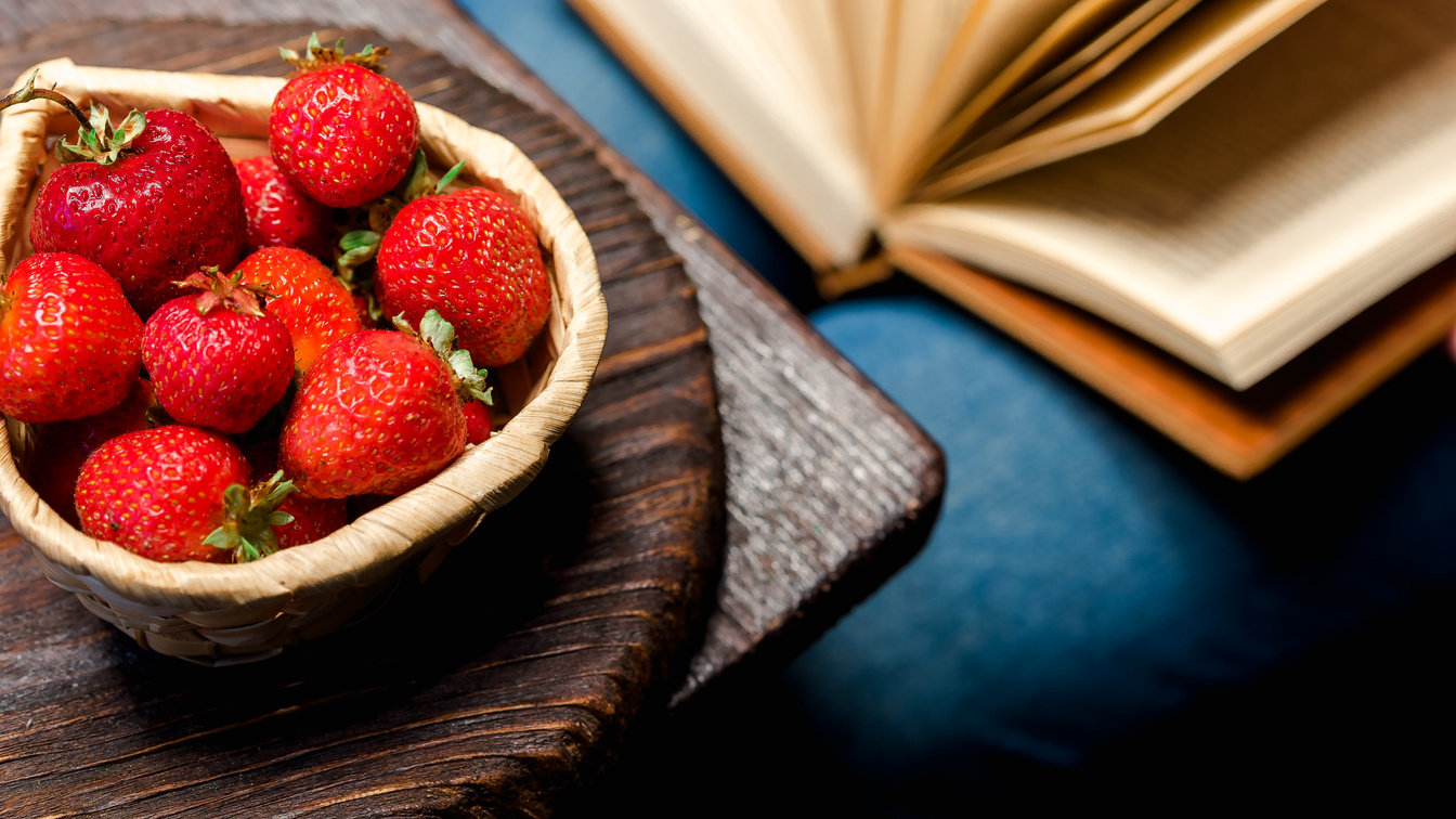 Reading and eating strawberries